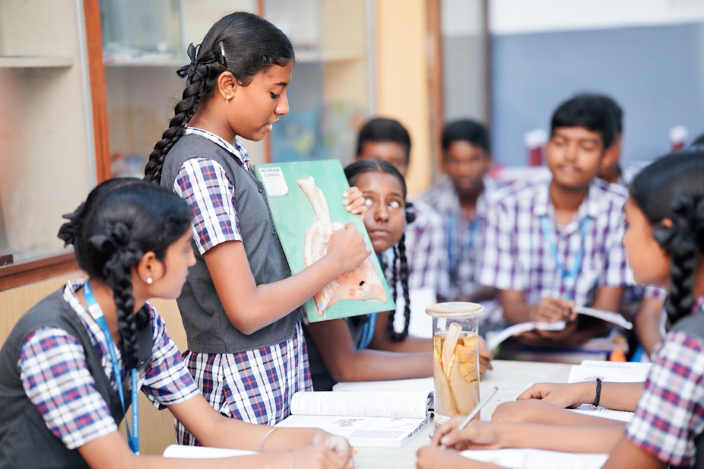 Biology laboratory with microscopes and anatomical models